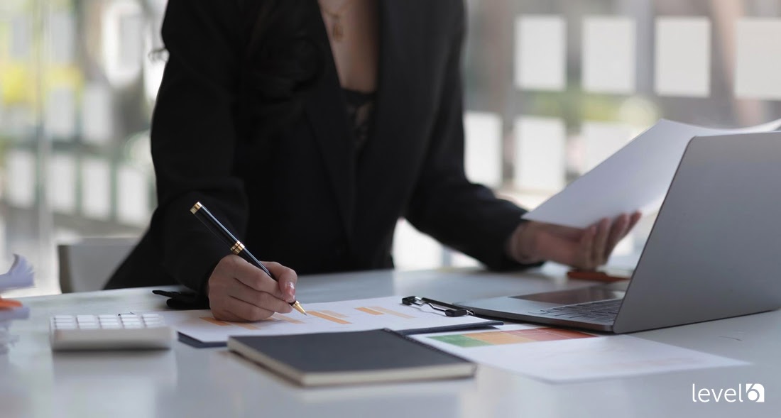 A Woman Reviewing Business Data